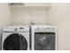 Close-up on the modern Samsung and Maytag washer and dryer units in laundry room at 291 Las Lomas St, Brighton, CO 80601