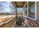 Inviting covered front porch featuring brick columns and a cozy seating area at 291 Las Lomas St, Brighton, CO 80601