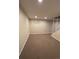 Cozy basement space featuring neutral paint and carpet and a small window for natural light at 10064 W Lake Dr, Littleton, CO 80127