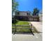 Charming two-story home with a well-manicured lawn and inviting curb appeal at 10064 W Lake Dr, Littleton, CO 80127