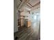 Functional laundry room featuring a washing machine, shelving, and durable vinyl flooring for easy maintenance at 10064 W Lake Dr, Littleton, CO 80127