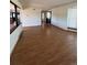 Spacious living area with gleaming hardwood floors and large windows allowing natural light at 10064 W Lake Dr, Littleton, CO 80127