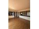 Open concept living room with hardwood floors, natural light, and views into kitchen at 10064 W Lake Dr, Littleton, CO 80127