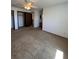 Spacious main bedroom featuring neutral carpet, ceiling fan, large closet, and en-suite bathroom at 10064 W Lake Dr, Littleton, CO 80127
