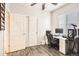 This bedroom features laminate floors, a ceiling fan, and a large closet at 13001 Grant Cir # C, Thornton, CO 80241