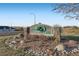 Community sign for Hunters Glen surrounded by landscaping and stones at 13001 Grant Cir # C, Thornton, CO 80241