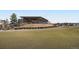 View of the Thorncreek Golf Course with modern clubhouse and beautifully kept green at 13001 Grant Cir # C, Thornton, CO 80241