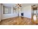Open living room featuring hardwood floors, fireplace, and natural light, creating a welcoming atmosphere at 13001 Grant Cir # C, Thornton, CO 80241