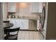 This well-lit kitchen features stainless steel appliances and ample counterspace for meal preparation at 7751 S Curtice Dr # E, Littleton, CO 80120