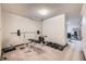 Basement workout room features weightlifting equipment and carpeted floors at 7751 S Curtice Dr # E, Littleton, CO 80120
