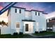 Charming two-story home with white siding, black shutters, and landscaped front yard at 22382 E 39Th Ave, Aurora, CO 80019