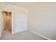 Bright bedroom with double door closet and neutral wall paint at 6952 Huddersfield Ln, Castle Pines, CO 80108