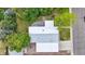 Aerial view of home showing backyard patio and trees with manicured lawn at 6068 S Clayton St, Centennial, CO 80121
