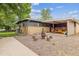 Spacious backyard features a brick patio, seating area, and well-manicured lawn at 6068 S Clayton St, Centennial, CO 80121