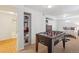 Cozy bedroom with a foosball table, closet, and comfortable bed at 6068 S Clayton St, Centennial, CO 80121