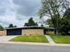 Charming single-story home with a well-maintained lawn and a modern design at 6068 S Clayton St, Centennial, CO 80121
