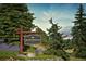 Entrance sign for Mount Vernon Canyon Club, surrounded by lush greenery and colorful flowers at 25803 Aspen Way, Golden, CO 80401