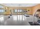 Bright gym featuring exercise equipment and multiple windows offering scenic views at 25803 Aspen Way, Golden, CO 80401