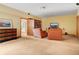 A cozy living room showcases plush seating, an ornate cabinet and a vintage TV at 25803 Aspen Way, Golden, CO 80401