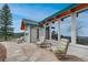 Inviting patio features comfortable seating and views, extending from the home with expansive windows at 25803 Aspen Way, Golden, CO 80401