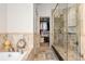 Elegant bathroom featuring walk-in glass shower and closet at 317 N Lafayette St, Denver, CO 80218