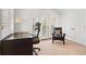 Bedroom with desk, chair, and large windows for ample natural light at 317 N Lafayette St, Denver, CO 80218