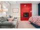 Stylish bedroom featuring a fireplace and sofa at 317 N Lafayette St, Denver, CO 80218