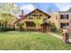 Charming home featuring a well-manicured front yard and beautiful architectural details at 317 N Lafayette St, Denver, CO 80218