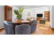 Inviting game room with hardwood floors, comfortable seating, and access to the living room at 317 N Lafayette St, Denver, CO 80218