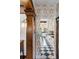 Hallway into the kitchen featuring unique period wallpaper and classic trim at 317 N Lafayette St, Denver, CO 80218