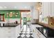 Bright, updated kitchen with black and white tile floors and modern appliances at 317 N Lafayette St, Denver, CO 80218