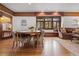 Open living room and dining room with a built-in window bench and stained glass at 317 N Lafayette St, Denver, CO 80218
