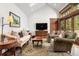 Bright living room with vaulted ceilings, hardwood floors, comfortable seating, and natural light at 317 N Lafayette St, Denver, CO 80218