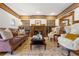 Cozy living room featuring a decorative fireplace, built-in shelving, and plush seating at 317 N Lafayette St, Denver, CO 80218