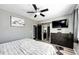 Comfortable bedroom with a ceiling fan, closet, and ensuite bathroom at 5032 Nighthawk Pkwy, Brighton, CO 80601