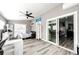 Cozy bedroom with a work space, fan, and sliding glass doors at 5032 Nighthawk Pkwy, Brighton, CO 80601