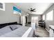 Cozy bedroom with a ceiling fan, sliding glass door, and a modern decor at 5032 Nighthawk Pkwy, Brighton, CO 80601