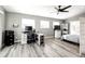 Comfortable bedroom space featuring a work desk, ceiling fan and ample natural light at 5032 Nighthawk Pkwy, Brighton, CO 80601