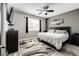 Well-lit bedroom featuring a plush bed and contemporary decor at 5032 Nighthawk Pkwy, Brighton, CO 80601