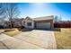 Inviting single-Gathering home with a brick-accented two-car garage and wide driveway at 5032 Nighthawk Pkwy, Brighton, CO 80601