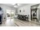 Bright kitchen with stainless steel appliances, a dining area and a view to the office space at 5032 Nighthawk Pkwy, Brighton, CO 80601