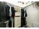 Organized walk-in closet with built-in shelving and drawers, offering ample storage space at 5032 Nighthawk Pkwy, Brighton, CO 80601