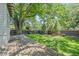 The fenced back yard features a wood deck and beautiful landscaping at 864 Garfield St, Denver, CO 80206