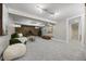 Finished basement features neutral carpet, built-in desk, and a comfortable seating area at 864 Garfield St, Denver, CO 80206