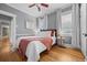 Well-lit bedroom with hardwood floors, a ceiling fan, and cozy decor at 864 Garfield St, Denver, CO 80206