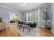 Light-filled dining room featuring hardwood floors, modern furniture, and view to living room at 864 Garfield St, Denver, CO 80206