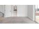 An open bedroom has neutral carpet, lots of light, and an ensuite bathroom nearby at 4232 Jason St # 2, Denver, CO 80211