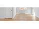 Neutral bedroom with light hardwood floors, white walls, and a window bringing in natural light at 4232 Jason St # 2, Denver, CO 80211