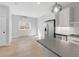 Bright kitchen with stainless appliances, gray countertops, and light wood flooring, offering a modern design at 4232 Jason St # 2, Denver, CO 80211
