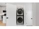 Convenient laundry room with stacked washer and dryer for efficient use of space at 4232 Jason St # 2, Denver, CO 80211